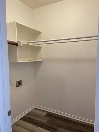 a view of an empty walk in closet