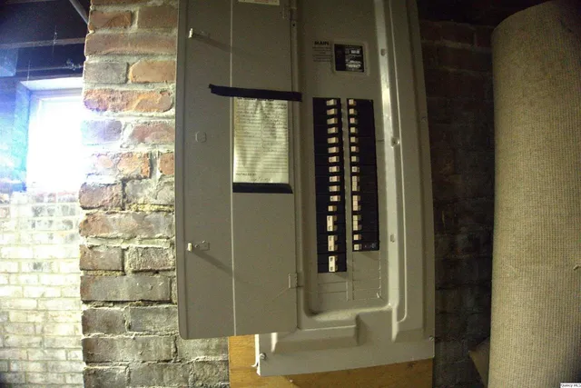 a view of a house with iron fence