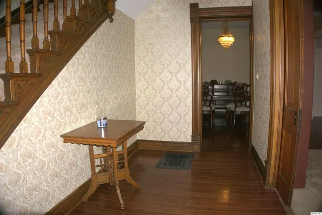 a kitchen with stainless steel appliances granite countertop a refrigerator and a stove