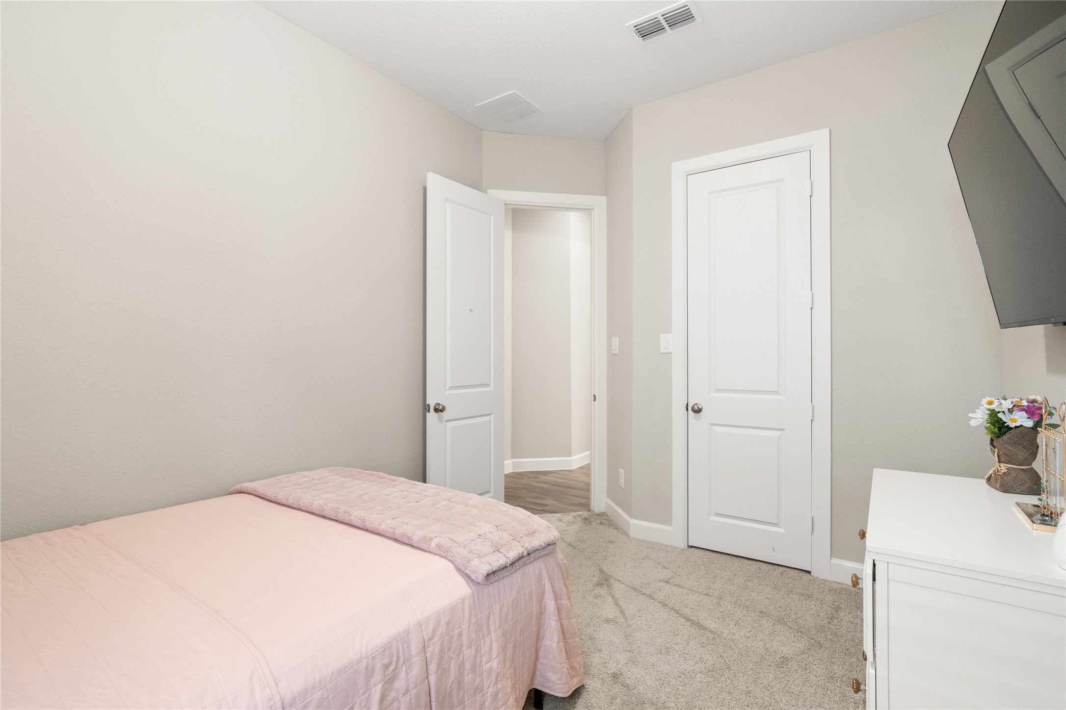 3118 Swift Way Katy, TX 77493 - Photo 29 of 34 Bedroom (Alternate View) – This angle highlights the room’s closet space and convenient layout, offering both comfort and functionality.