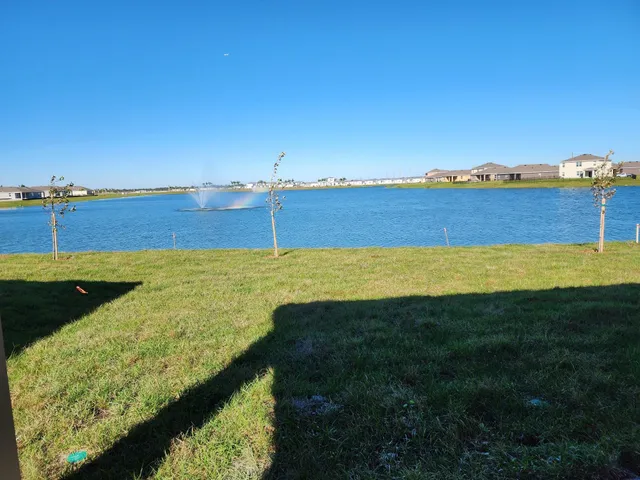 a view of a large swimming pool and an ocean view