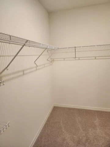 a view of a room with racks on the wall