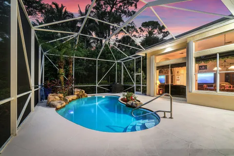 a view of a room with wooden floor and iron fence