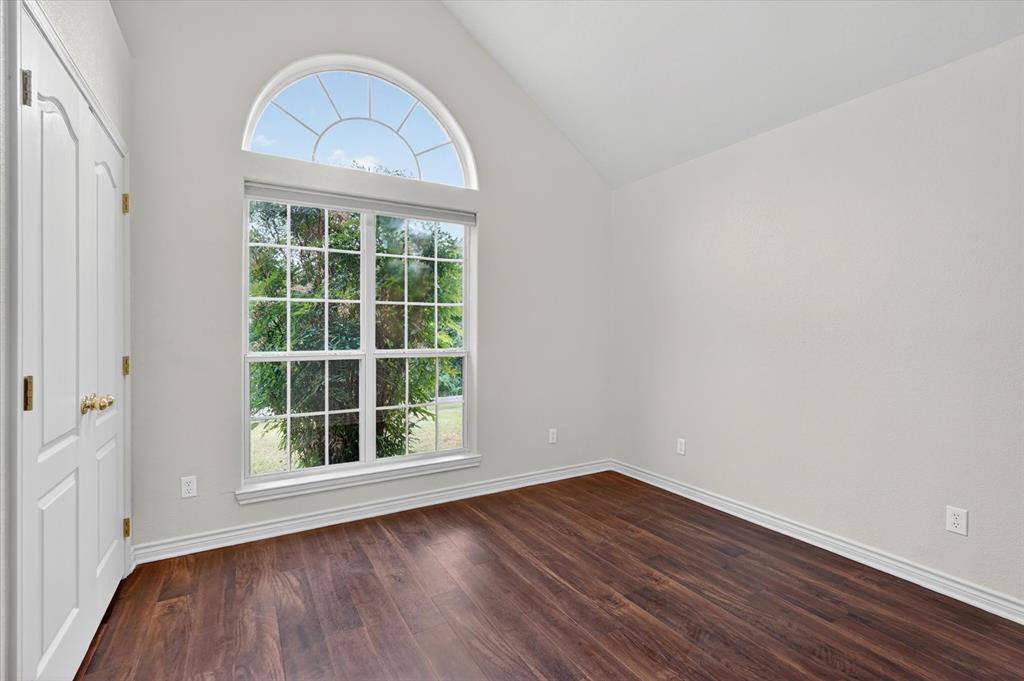 2828 Bennett Road Howe, TX 75459 - Photo 29 of 39 a view of empty room with wooden floor and fan