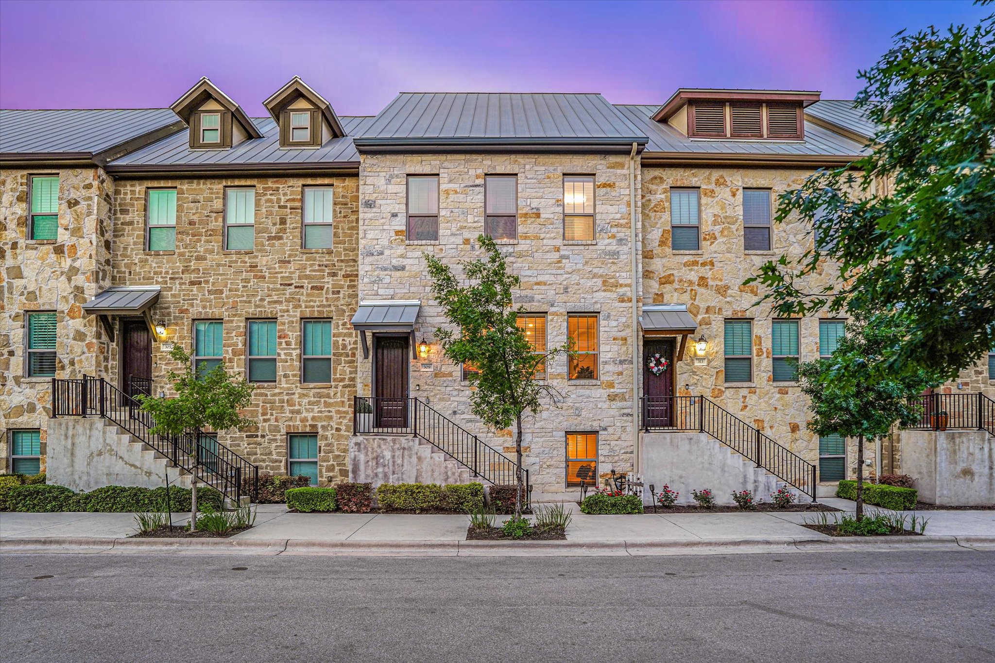 309 Adams Street Georgetown, TX 78628 - Photo 2 of 30 View of front of home with stone siding and a metal roof