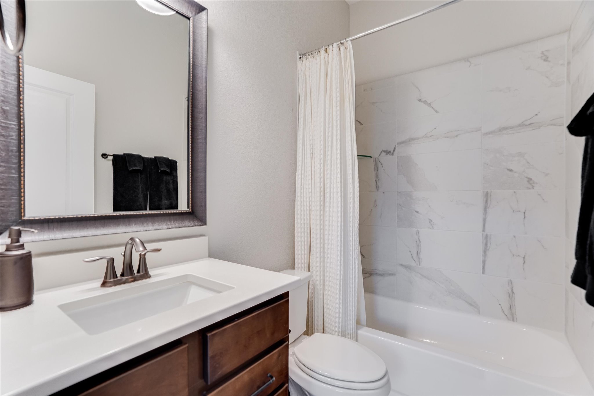 309 Adams Street Georgetown, TX 78628 - Photo 20 of 30 Full bath with vanity and shower / bath combination with curtain