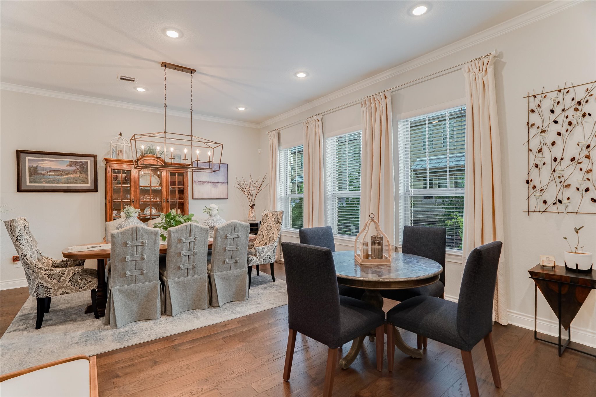 309 Adams Street Georgetown, TX 78628 - Photo 9 of 30 Dining space with hardwood / wood-style flooring, ornamental molding, and a chandelier