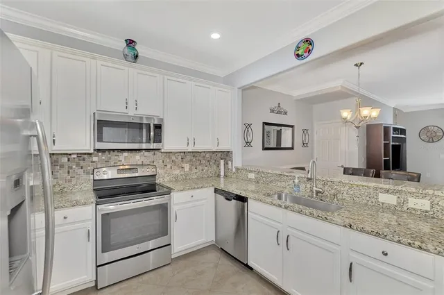 a kitchen with a refrigerator and cabinets