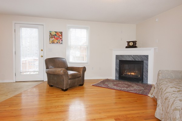 53 Lancaster Road, Unit 10 Clinton, MA 01510 - Photo 3 of 20 a living room with furniture and a fireplace