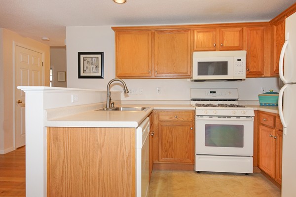 53 Lancaster Road, Unit 10 Clinton, MA 01510 - Photo 6 of 20 a kitchen with stainless steel appliances a sink stove and cabinets