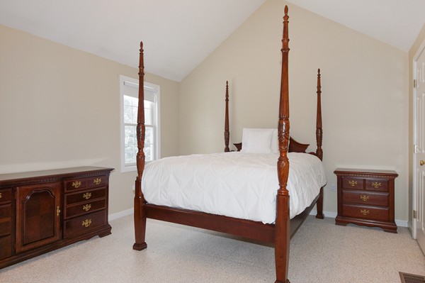 53 Lancaster Road, Unit 10 Clinton, MA 01510 - Photo 10 of 20 a bed room with a bed and a dresser
