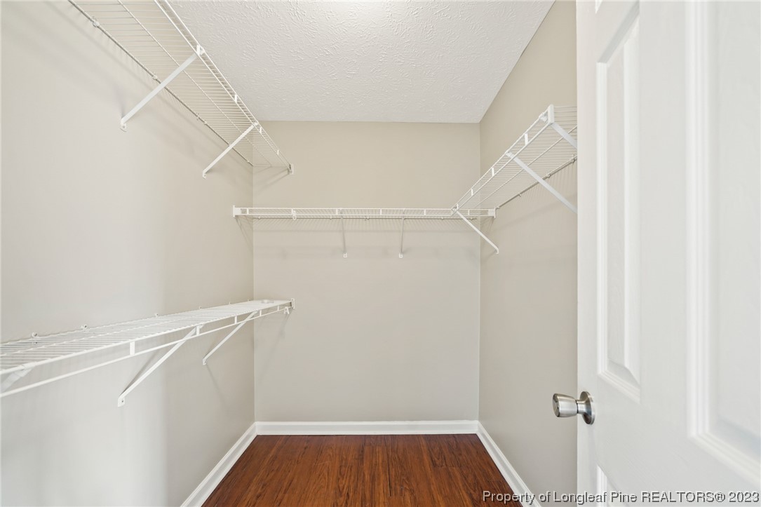149 Cavalier Drive Raeford, NC 28376 - Photo 19 of 31 a view of walk in closet with empty racks