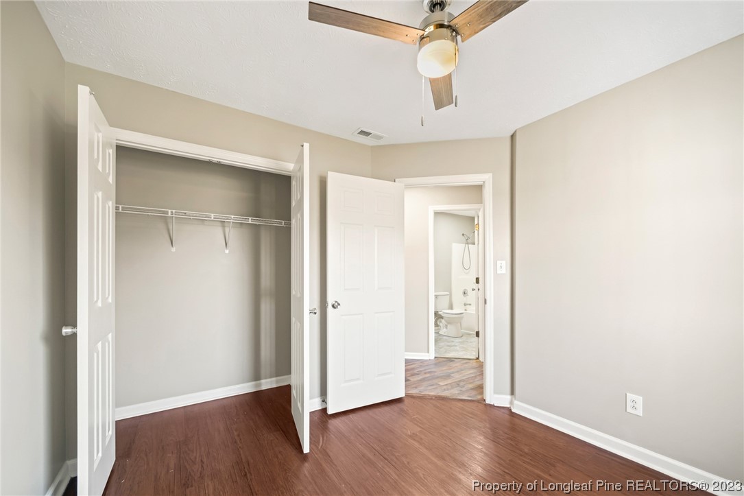 149 Cavalier Drive Raeford, NC 28376 - Photo 21 of 31 an empty room with wooden floor a ceiling fan