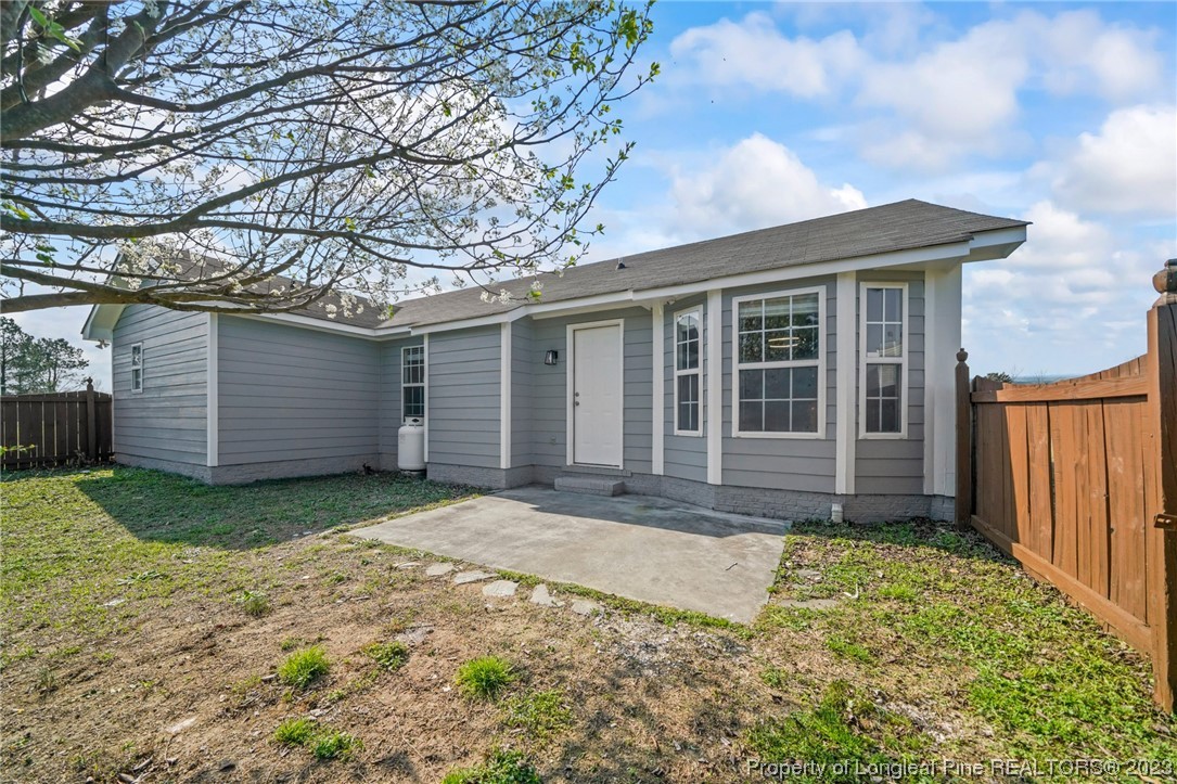 149 Cavalier Drive Raeford, NC 28376 - Photo 26 of 31 a front view of a house with a yard