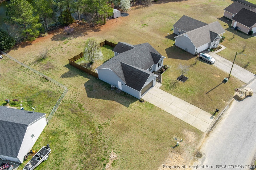 149 Cavalier Drive Raeford, NC 28376 - Photo 28 of 31 an aerial view of residential houses with outdoor space