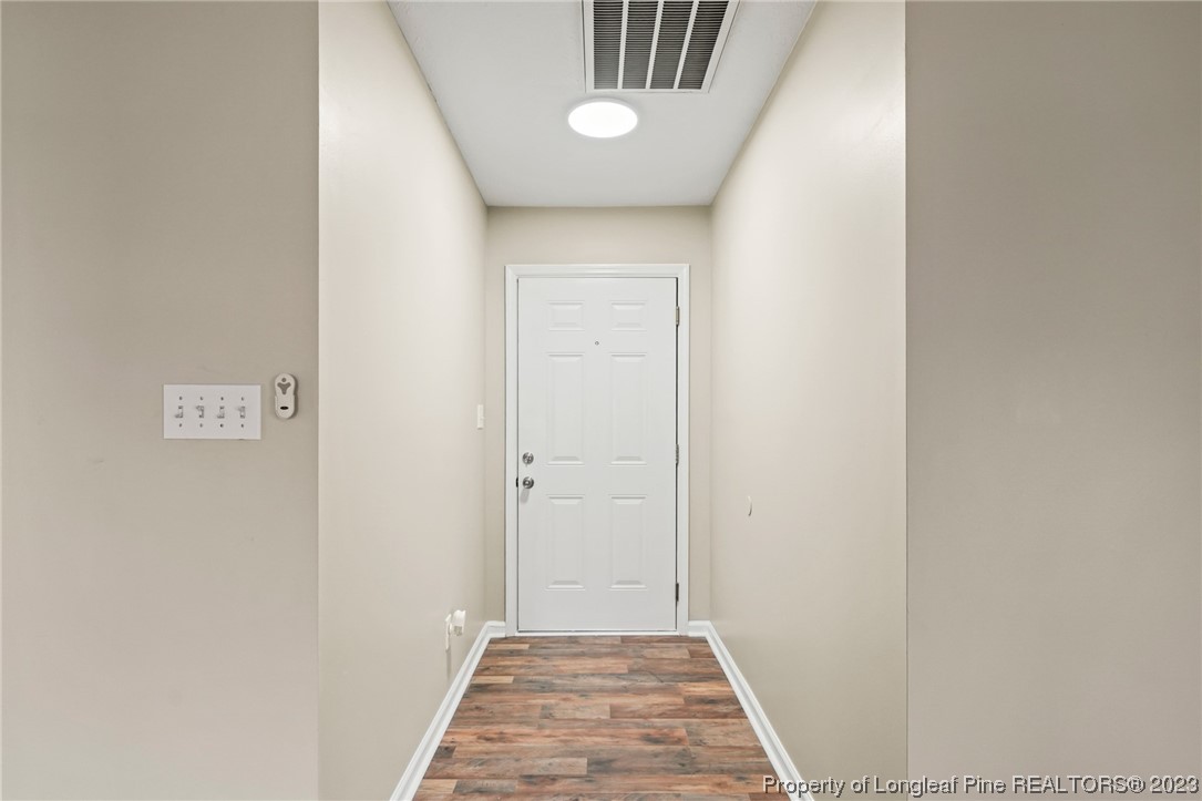 149 Cavalier Drive Raeford, NC 28376 - Photo 4 of 31 a view of a hallway with wooden floor