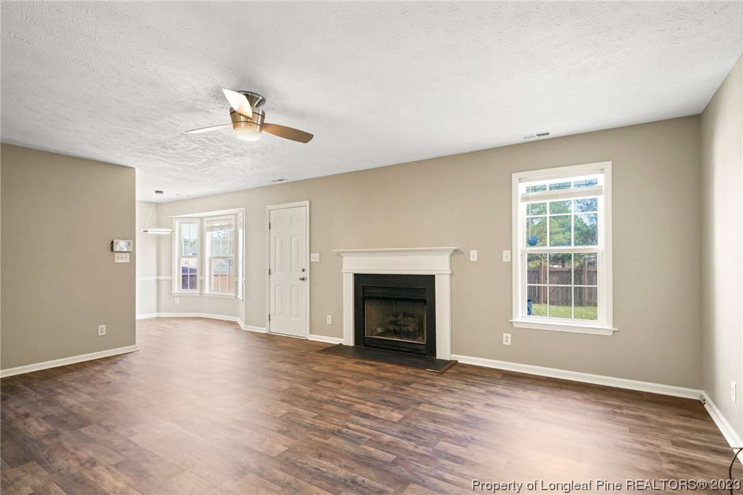149 Cavalier Drive Raeford, NC 28376 - Photo 5 of 31 a view of an empty room with a window and fireplace