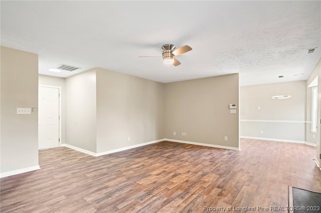 149 Cavalier Drive Raeford, NC 28376 - Photo 6 of 31 wooden floor in an empty room with a window