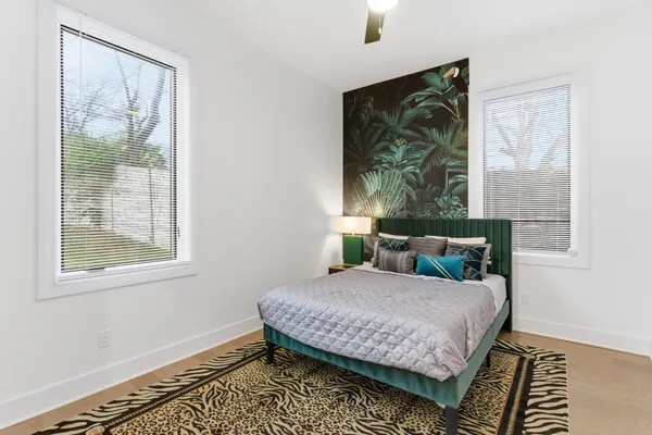 a bedroom with a bed and a window