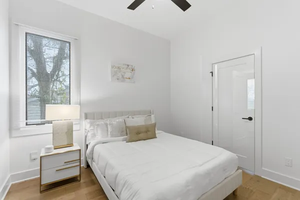 a bedroom with a bed and a window