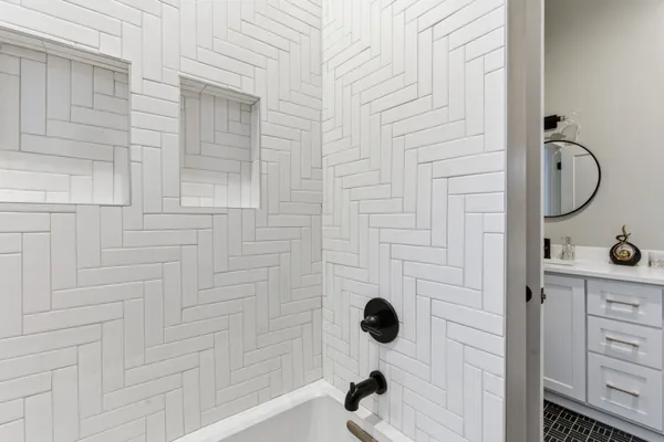 a bathroom with a shower and a sink