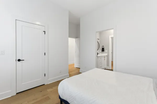 a bedroom with a bed and closet