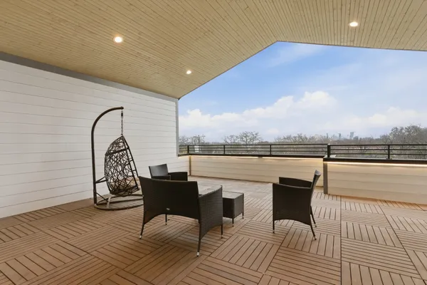 a view of roof deck with seating space and barbeque oven