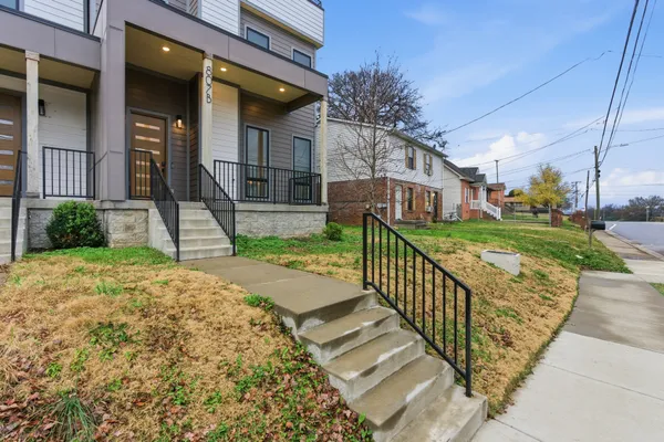 a view of a house with brick walls
