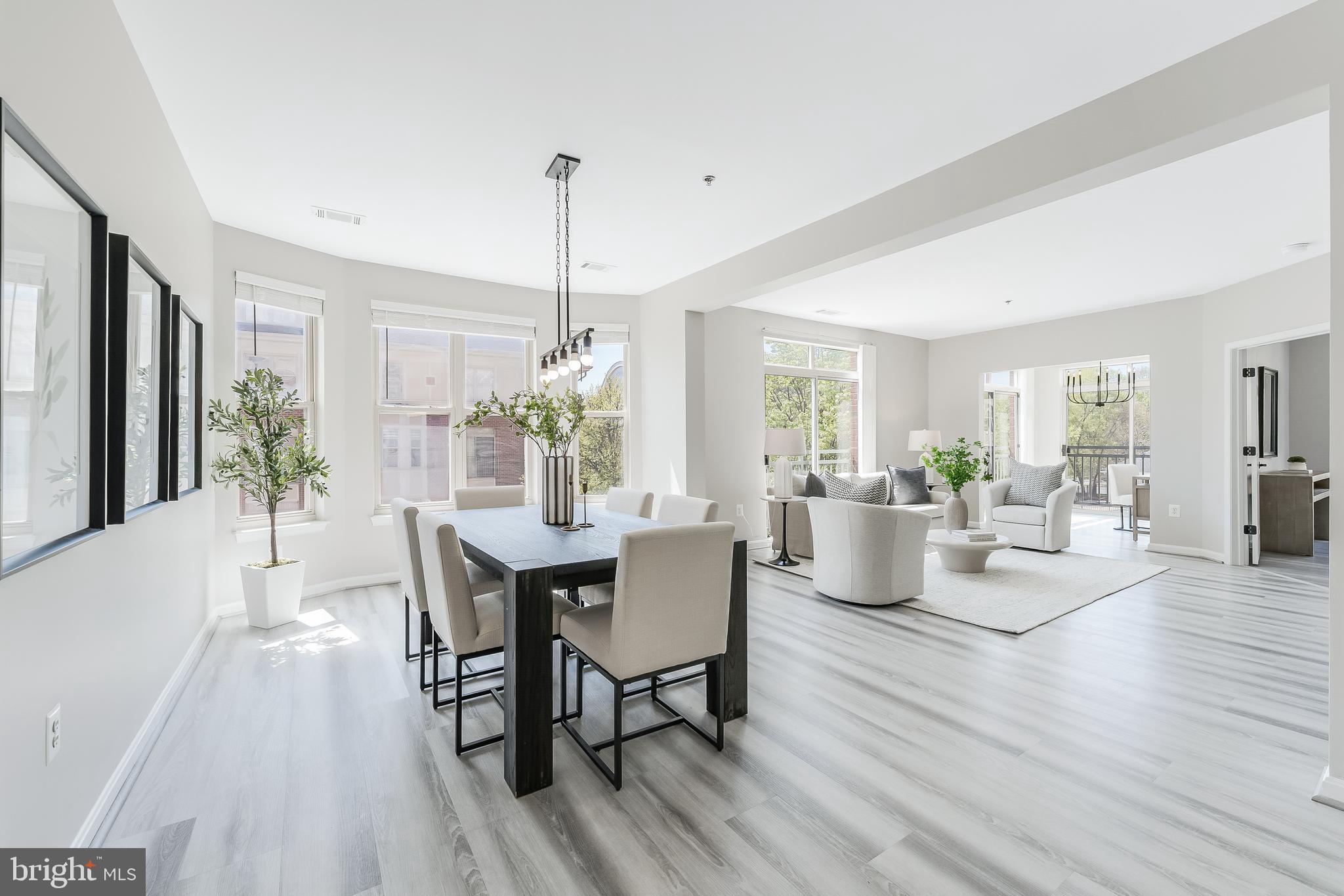 1851 Stratford Park Place, Unit 212 Reston, VA 20190 - Photo 13 of 45 a view of a dining room with furniture window and wooden floor