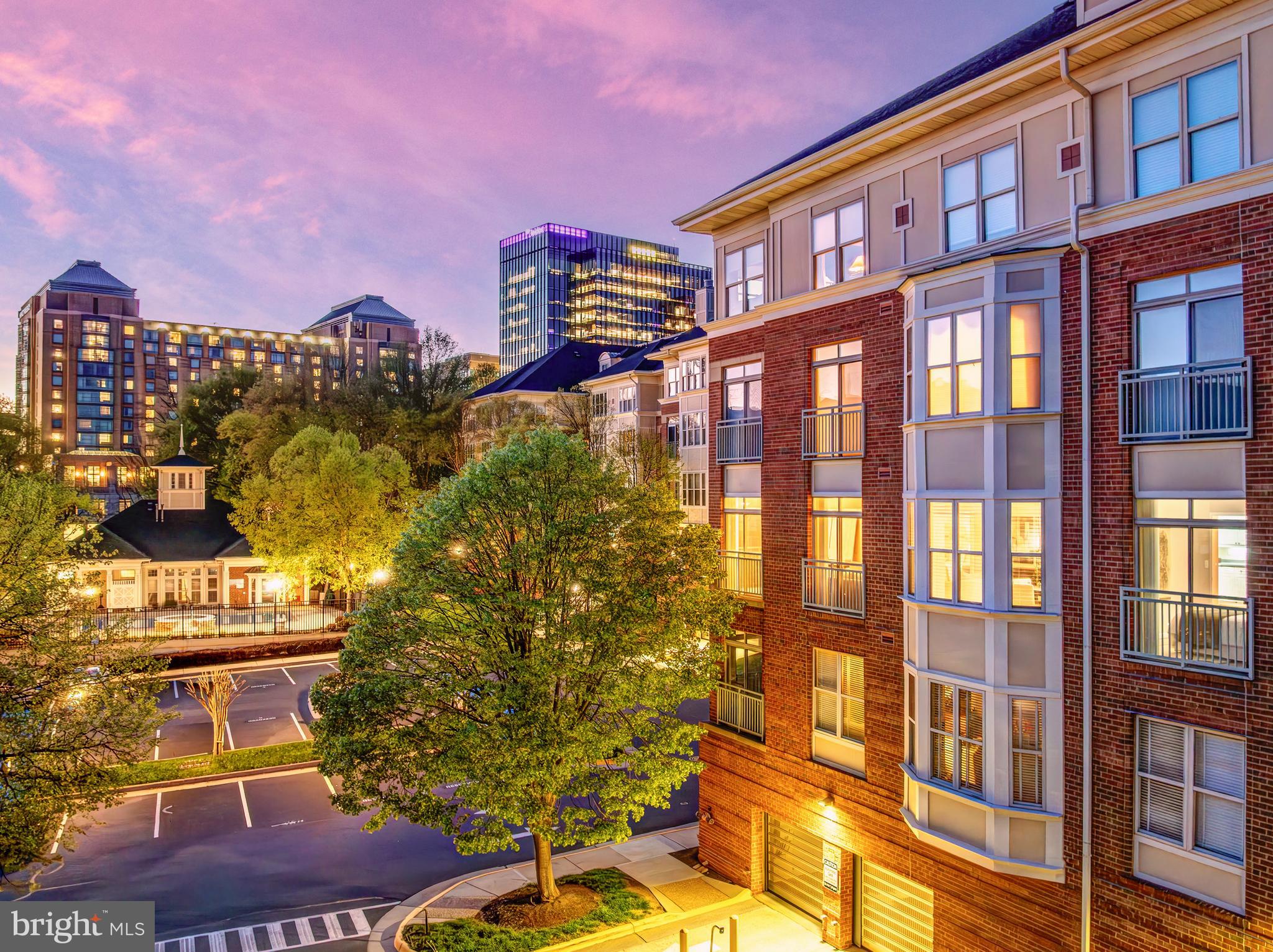 1851 Stratford Park Place, Unit 212 Reston, VA 20190 - Photo 2 of 45 a city street lined with tall buildings