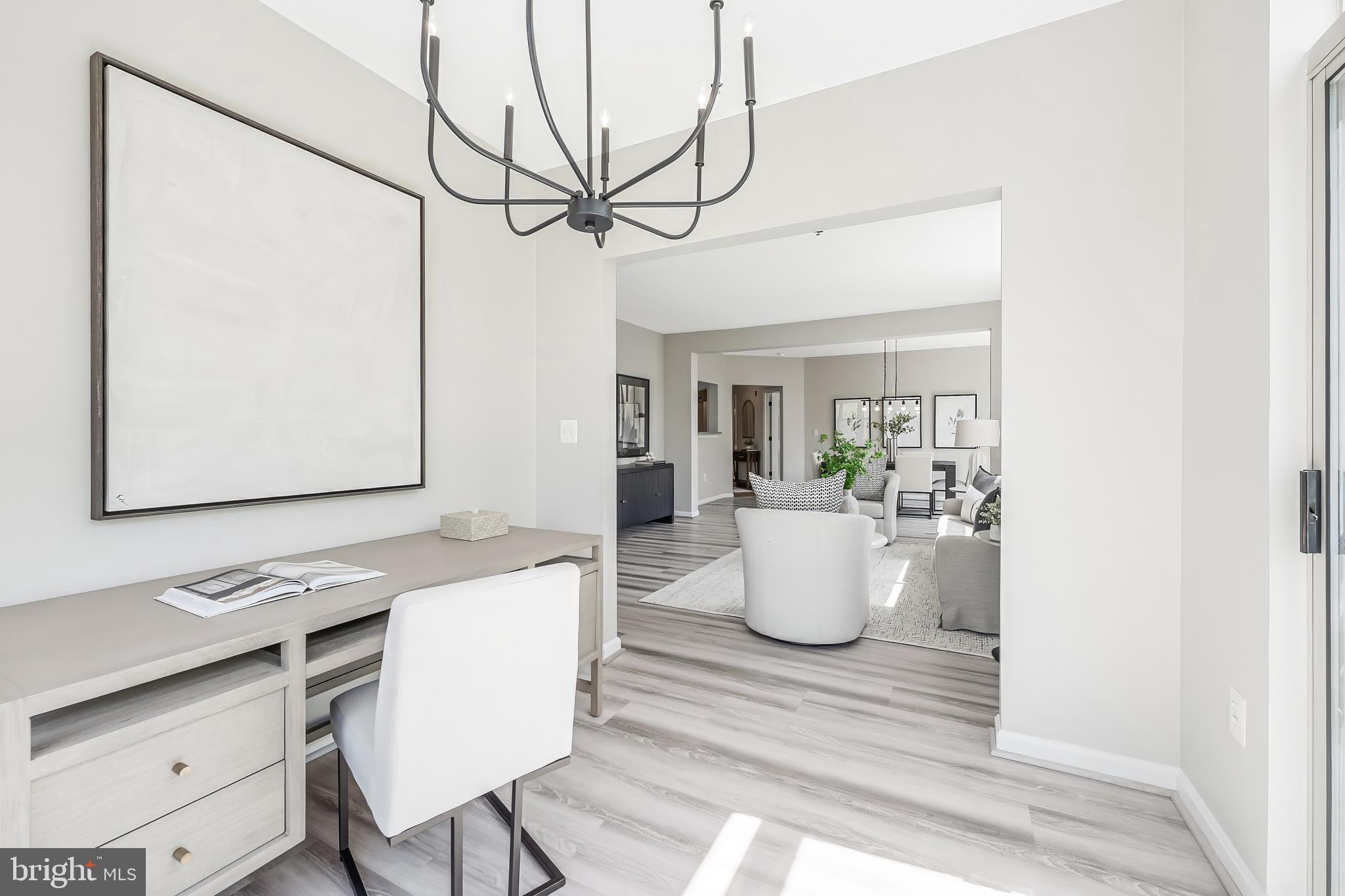 1851 Stratford Park Place, Unit 212 Reston, VA 20190 - Photo 23 of 45 a room with a table and chairs
