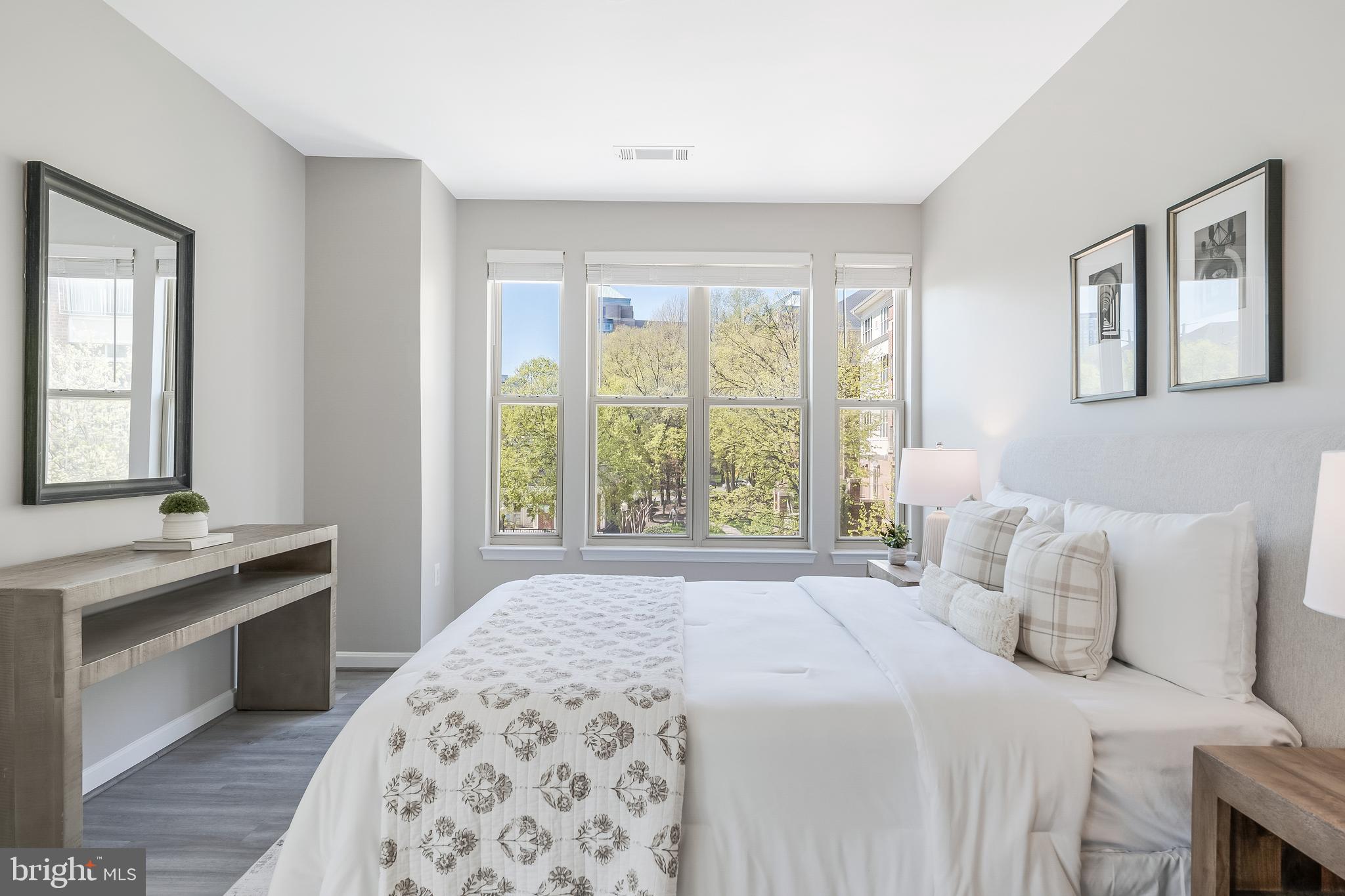1851 Stratford Park Place, Unit 212 Reston, VA 20190 - Photo 26 of 45 a bedroom with a bed and a window