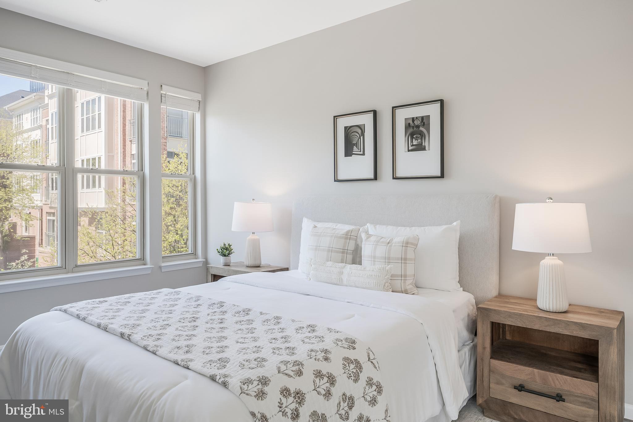 1851 Stratford Park Place, Unit 212 Reston, VA 20190 - Photo 31 of 45 a bedroom with a bed and a window