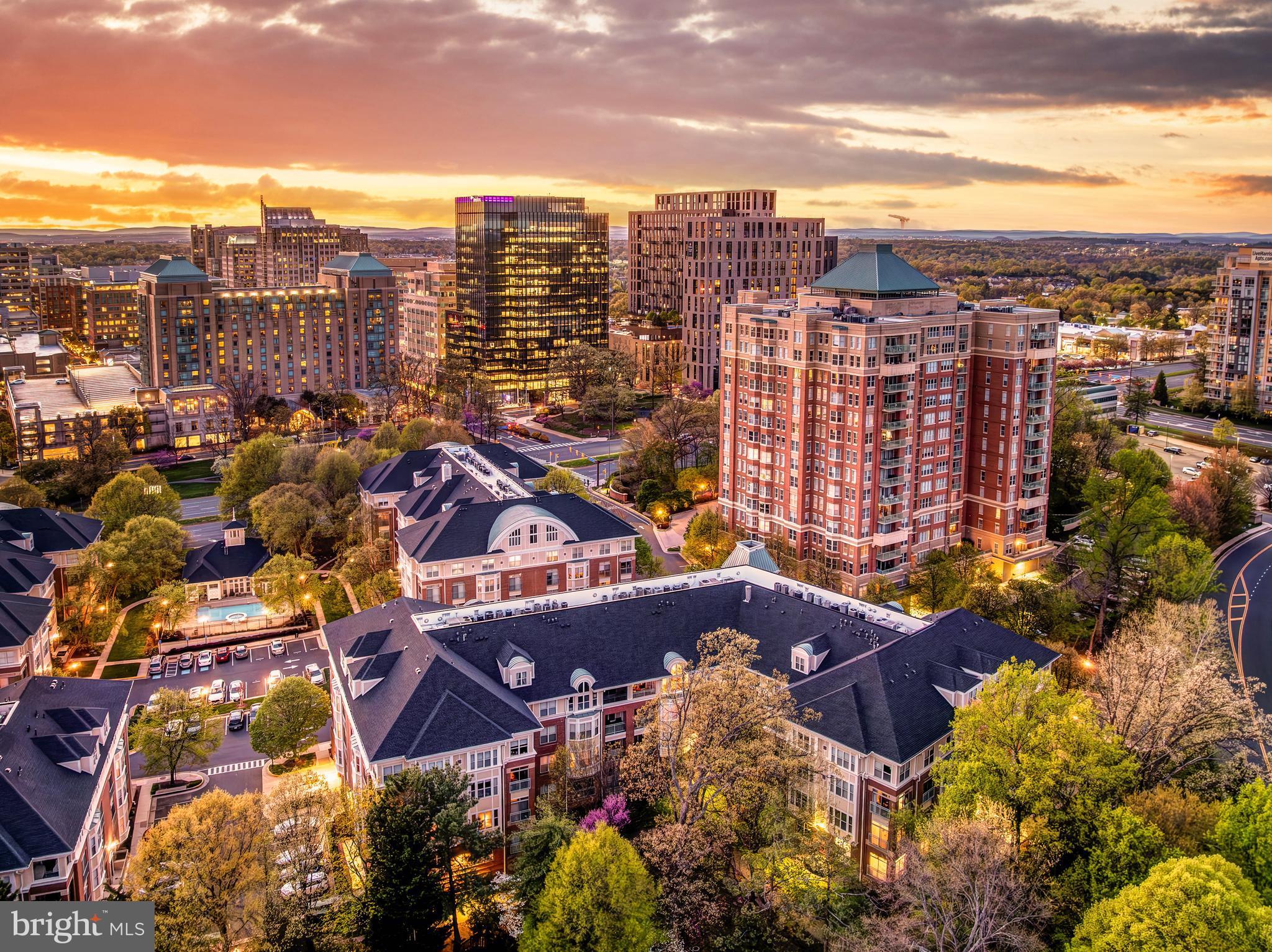 1851 Stratford Park Place, Unit 212 Reston, VA 20190 - Photo 4 of 45 a view of a city with tall buildings