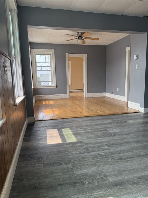157 Vernon Street, Unit 3 Worcester, MA 01610 - Photo 2 of 15 a view of empty room with wooden floor
