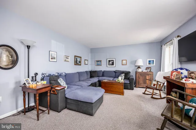 a kitchen that has a lot of cabinets a sink and a stove in it