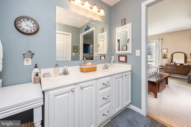 a spacious bedroom with a bed and a cabinets