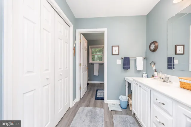 a bedroom with a bed and dresser