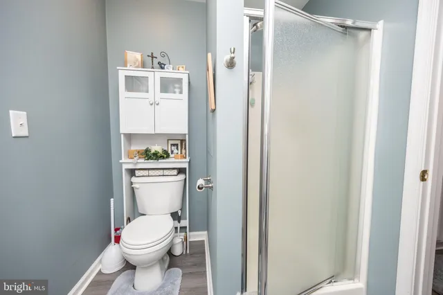 a bedroom with a bed and a fireplace