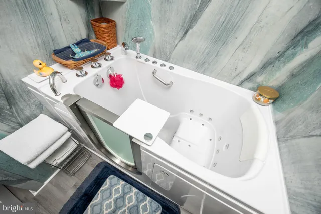 a view of a bedroom with clothes and shoes