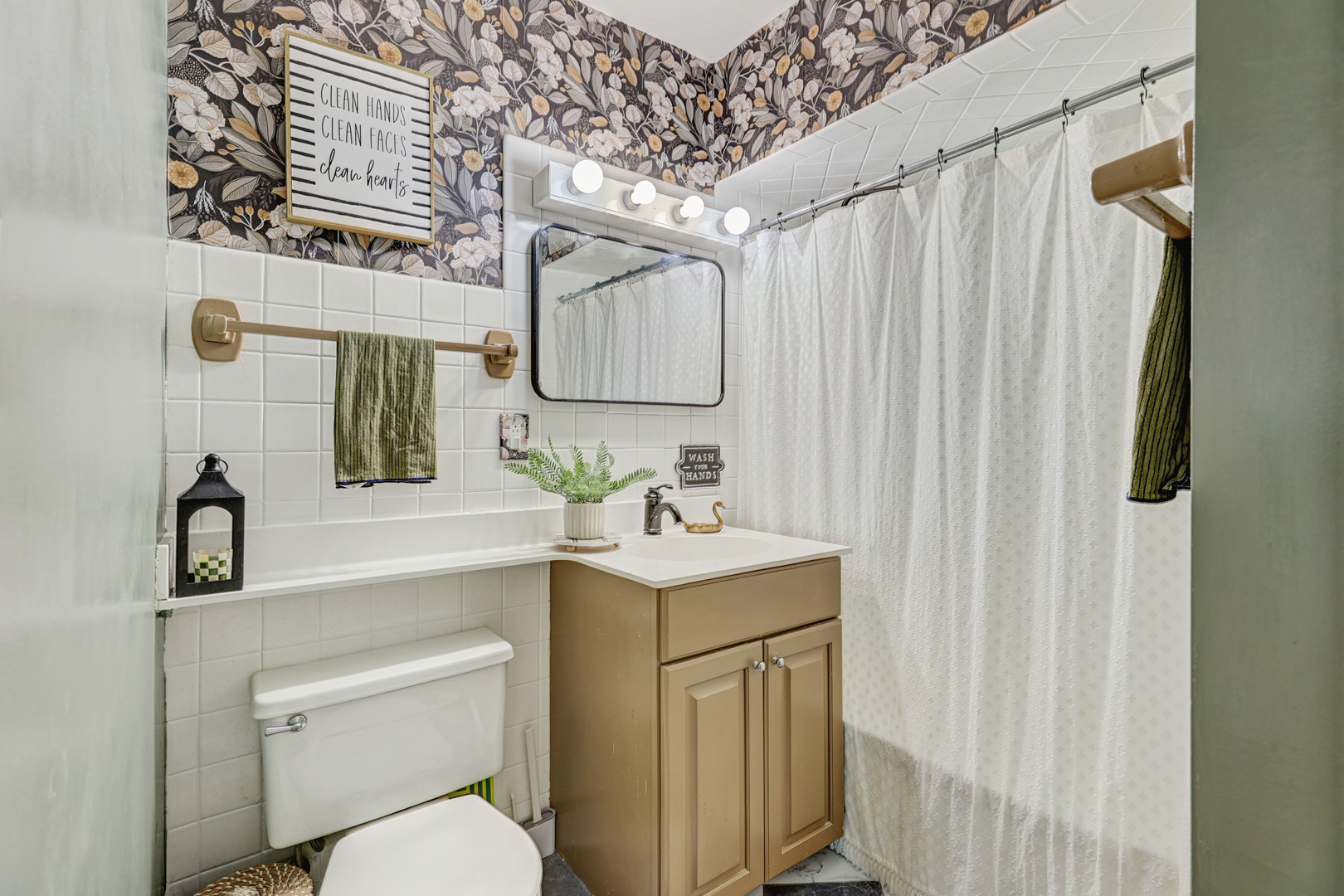 832 Sylviawood Avenue Park Ridge, IL 60068 - Photo 13 of 29 a bathroom with a sink toilet vanity and shower