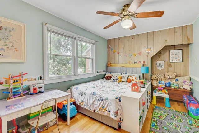 a bedroom with a bed and a window in it