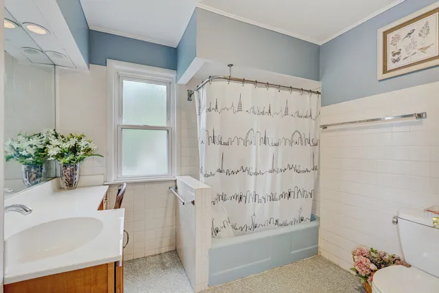 a bathroom with a sink a toilet and a bathtub
