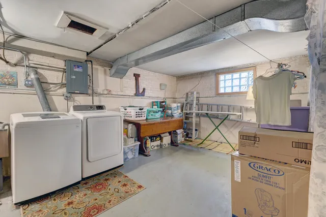 a view of a kitchen with utility room and windows