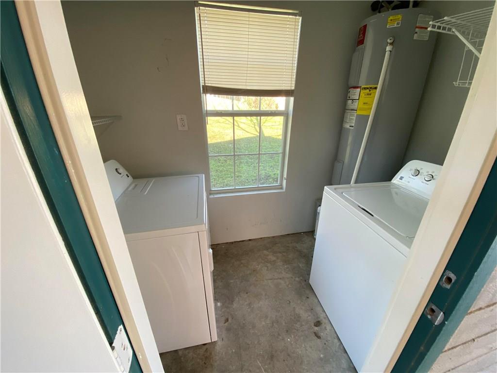6113 Manor Road, Unit A Austin, TX 78723 - Photo 13 of 13 Washer & Dryer are included. Natural light brightens a functional laundry space and concrete flooring and a window overlooking the yard.