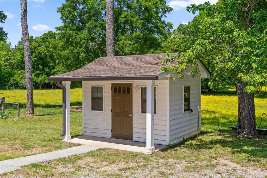 446 Brown Bridge Road Chatsworth, GA 30705 - Photo 24 of 75 a view of a house with backyard porch and garden
