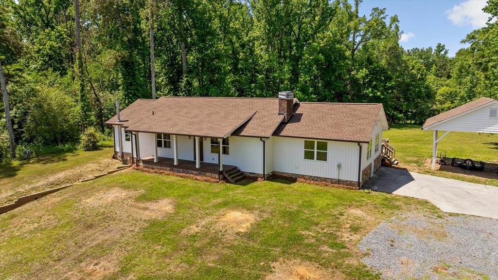 446 Brown Bridge Road Chatsworth, GA 30705 - Photo 25 of 75 an aerial view of a house with swimming pool and deck