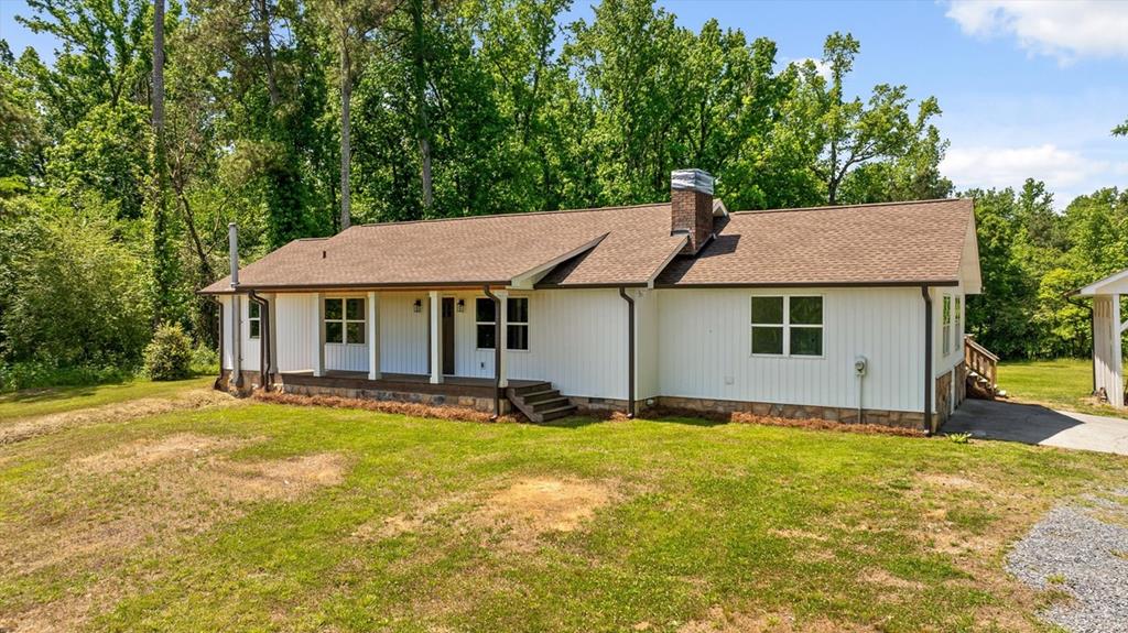 446 Brown Bridge Road Chatsworth, GA 30705 - Photo 29 of 75 a aerial view of a house with swimming pool next to a yard
