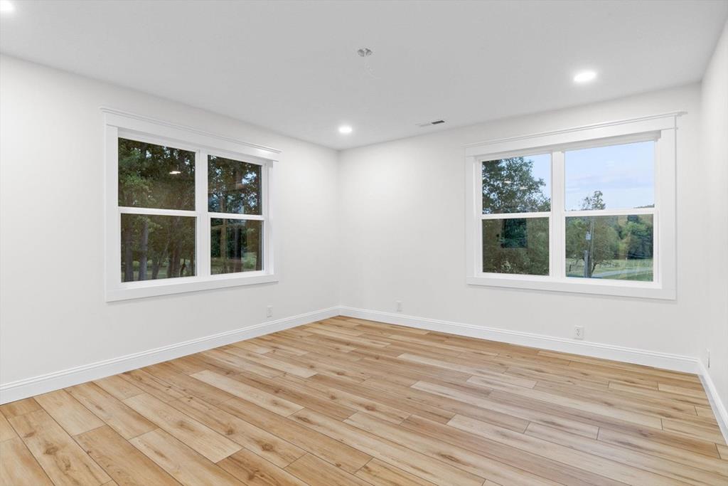 446 Brown Bridge Road Chatsworth, GA 30705 - Photo 53 of 75 a view of an empty room with wooden floor and a window