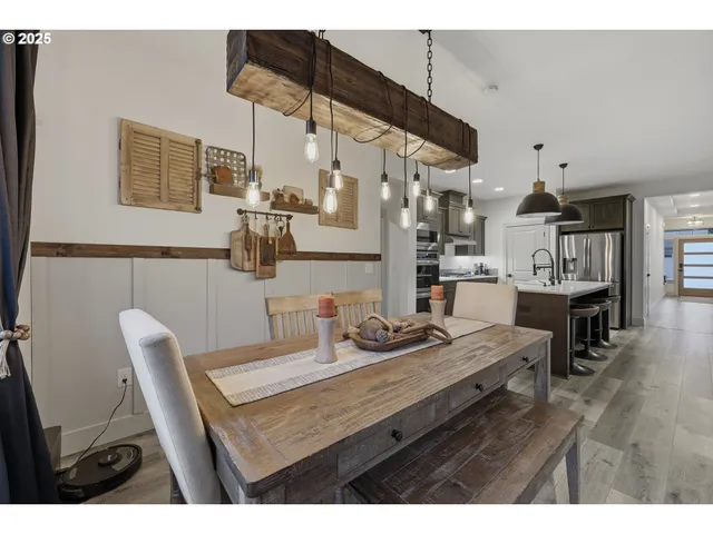 a dining room with furniture and wooden floor